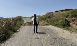 İzmir'de arazisinden izinsiz geçildiğini iddia eden kişi yolu trafiğe kapattı