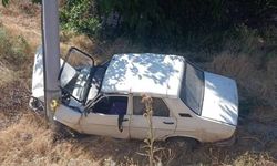 Uşak Güre'de otomobil şarampole devrildi